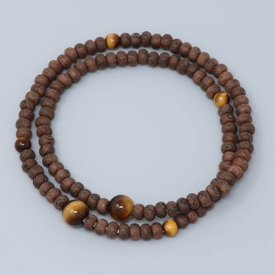 Rosary Bracelet in Striped ironwood spiked with tiger eyes