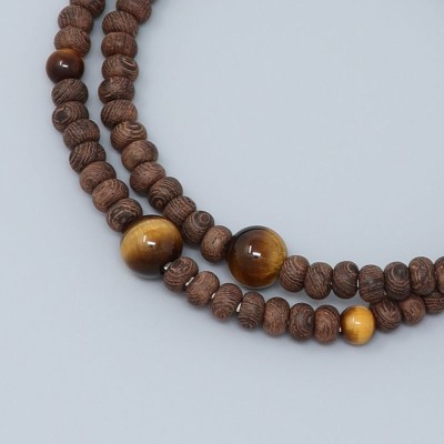 Rosary Bracelet in Striped ironwood spiked with tiger eyes